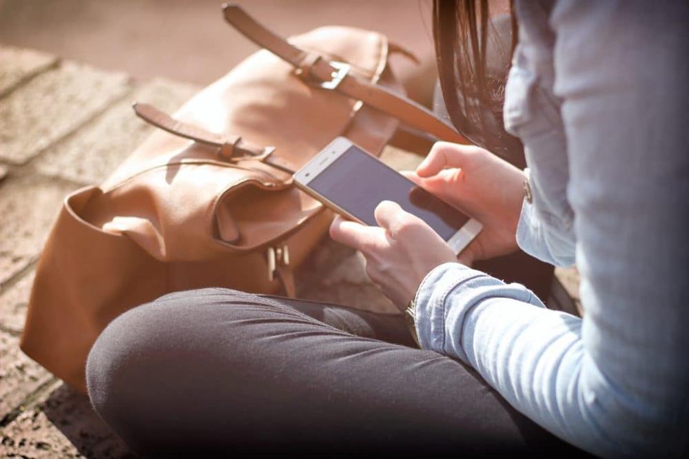 A close up of someone using their phone